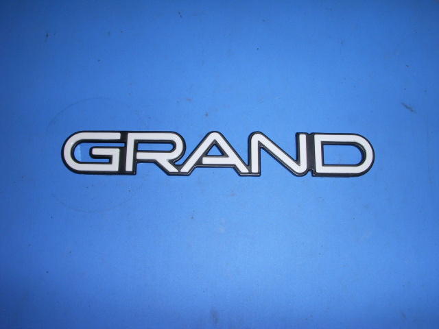 1980? Pontiac Plate Assembly "Grand" NOS # 10056996