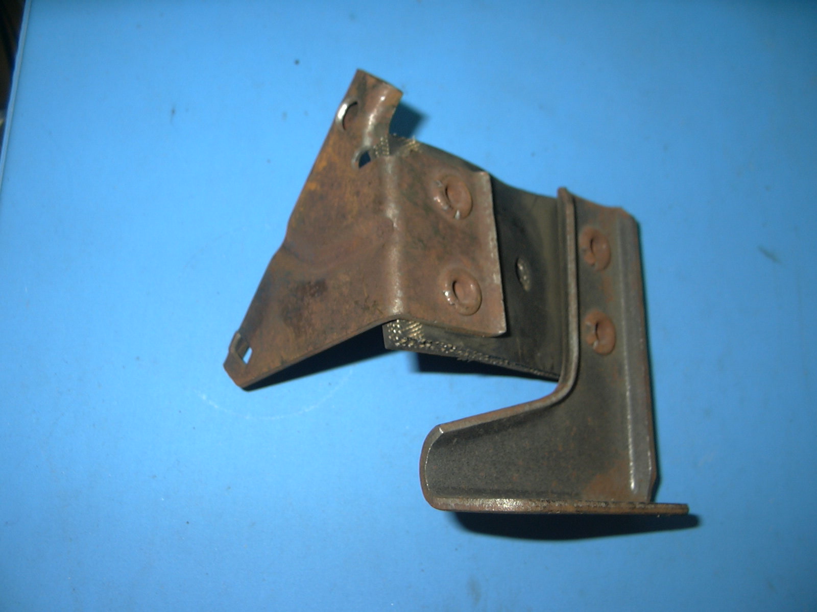 1960 Oldsmobile Right Hand Rear Tailpipe Bracket NOS # 577154