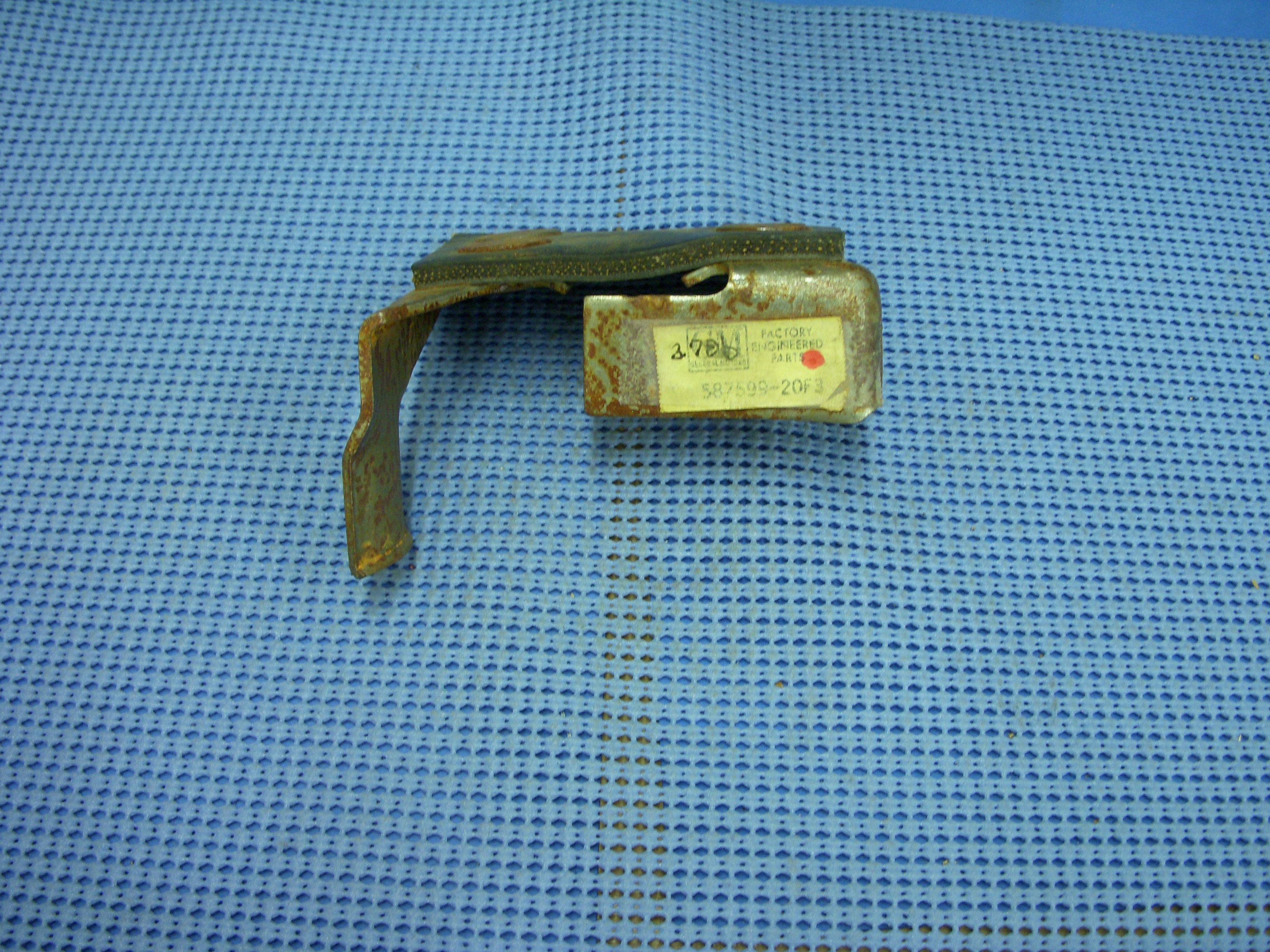1963-1964 Oldsmobile Left Hand Resonator Rear Support NOS # 587599